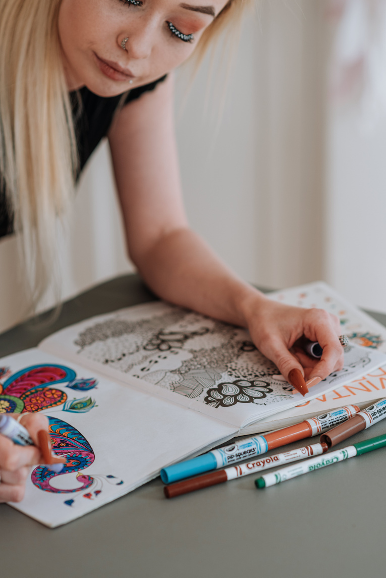 A Woman Looking at the Drawing on the Paper